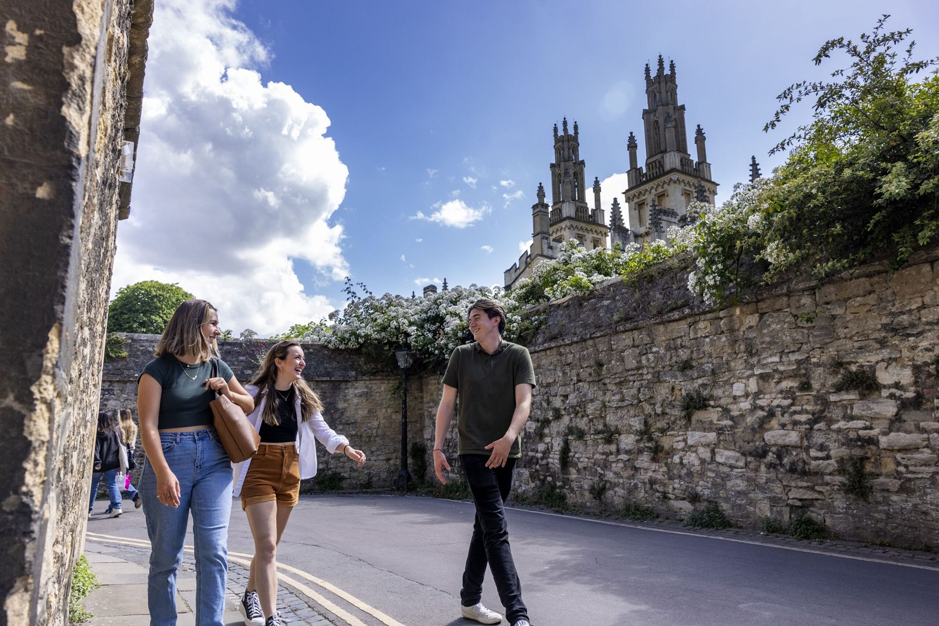 Three students walk away from the UGA at Oxford Centre.