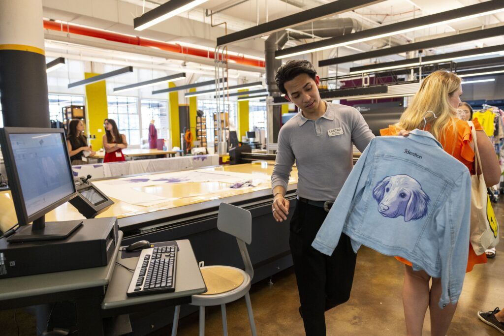 University of Georgia students take a tour of a clothing factory. 